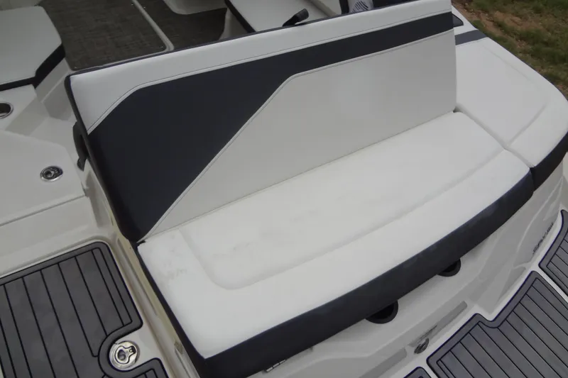 Slide: The Image of 2018 Sea Ray SPX 210 boat seating area with sleek black and white upholstery. - 16