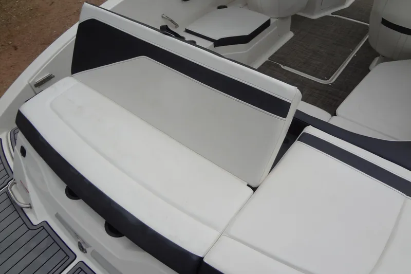Slide: The Image of 2018 Sea Ray SPX 210 boat interior with white and black seating. - 17