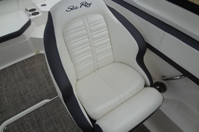 Slide: The Image of 2018 Sea Ray SPX 210 boat seat, white and black design, luxurious interior. - 24