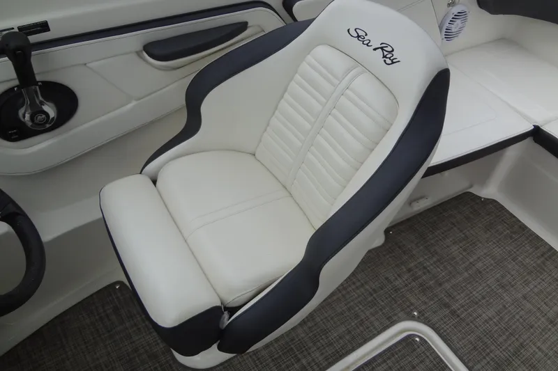 Slide: The Image of Captain's seat in 2018 Sea Ray SPX 210 boat, featuring sleek white and black design. - 25