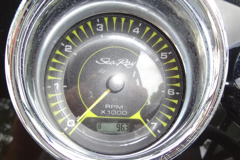 Slide: The Image of Close-up of a Sea Ray SPX 210 tachometer displaying 963 RPM. - 28