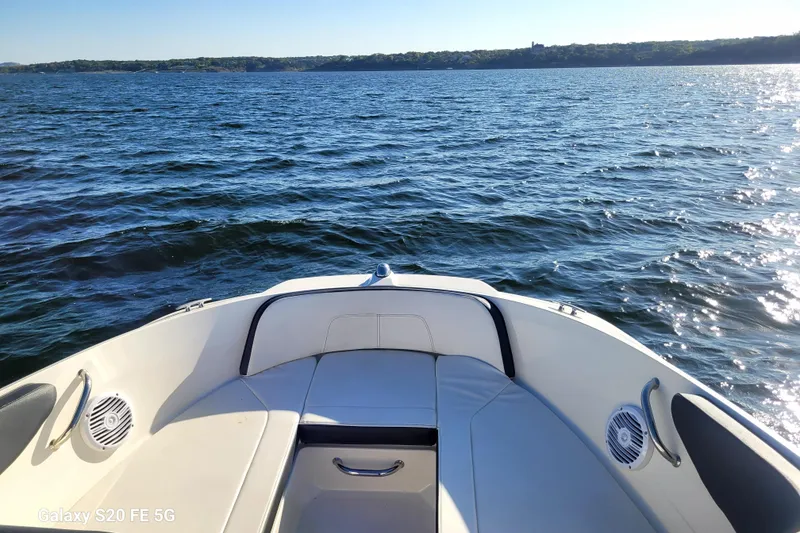 Slide: The Image of 2018 Sea Ray SPX 210 boat on calm water, sunny day, scenic view. - 35