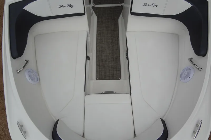 Slide: The Image of Interior view of a 2018 Sea Ray SPX 210 boat with white seating. - 9