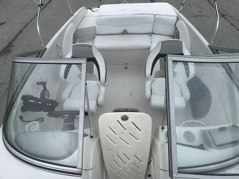 Slide: The Image of Interior view of a 2008 Tahoe Q7SI boat with white seating. - 11