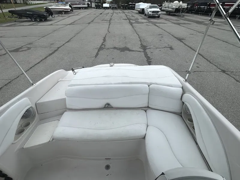 Slide: The Image of Interior view of a 2008 Tahoe Q7SI boat with white seating. - 13