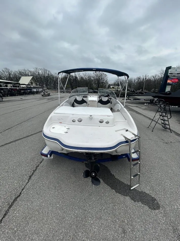 Slide: The Image of 2008 Tahoe Q7SI boat parked under cloudy skies. - 3