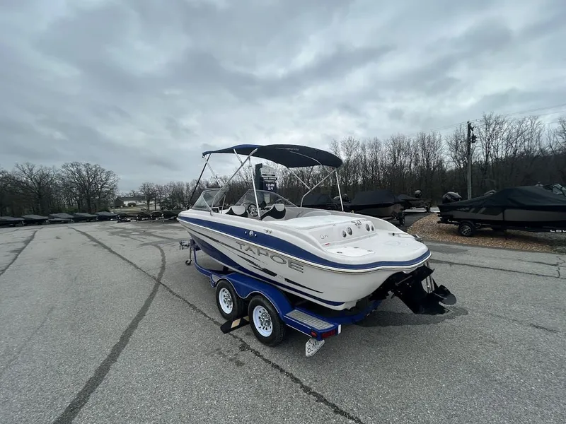 Slide: The Image of 2008 Tahoe Q7SI boat on trailer, cloudy sky. - 4