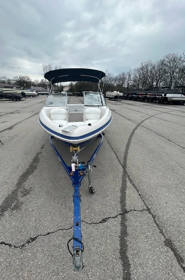 Slide: The Image of 2008 Tahoe Q7SI boat on trailer, cloudy sky. - 6