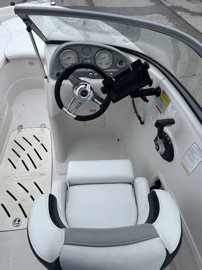 Slide: The Image of Interior of a 2008 Tahoe Q7SI boat with steering console. - 7
