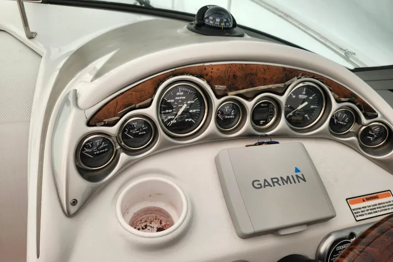 Slide: The Image of Dashboard of a 2005 Crownline 275 CCR boat with Garmin navigation system. - 16