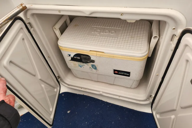 Slide: The Image of Storage compartment with cooler on a 2005 Crownline 275 CCR boat. - 9