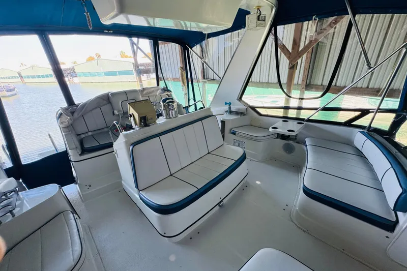 Slide: The Image of Interior of a 1989 Carver 38 Santego yacht with spacious seating and helm. - 32
