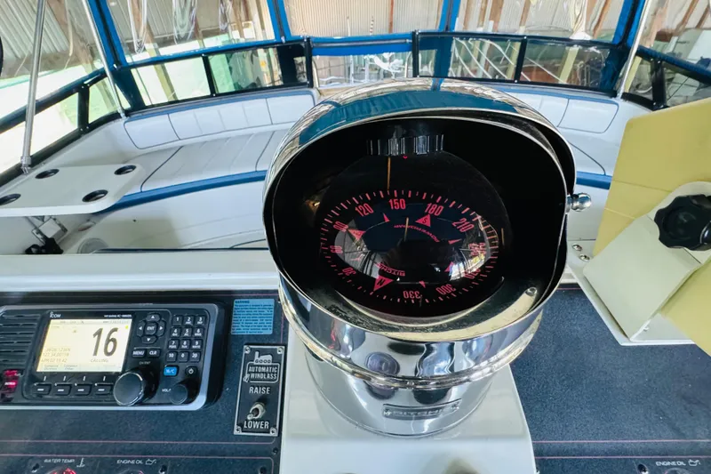 Slide: The Image of 1989 Carver 38 Santego boat helm with compass and navigation equipment. - 41