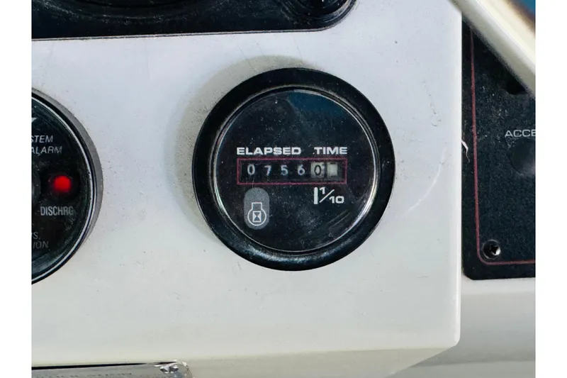 Slide: The Image of Elapsed time gauge on 1989 Carver 38 Santego boat dashboard, showing 756 hours. - 42