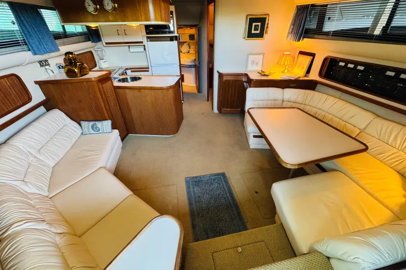 Slide: The Image of Luxurious interior of a 1989 Carver 38 Santego yacht with plush seating and elegant decor. - 44