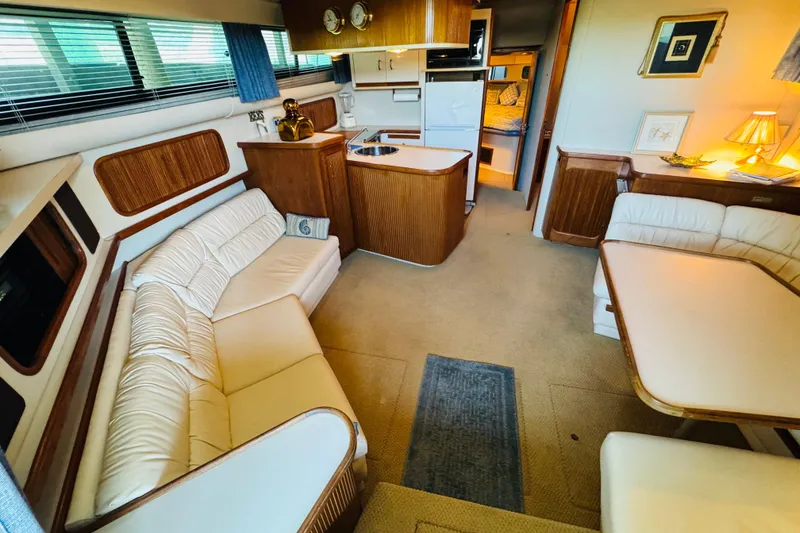 Slide: The Image of Interior of 1989 Carver 38 Santego yacht with cozy seating and elegant wood finishes. - 46