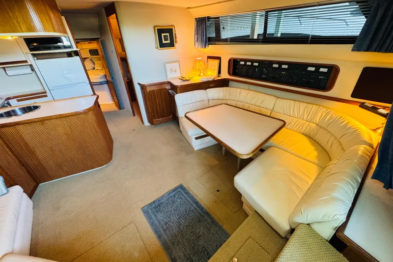 Slide: The Image of Interior of 1989 Carver 38 Santego yacht with cozy seating and modern amenities. - 47
