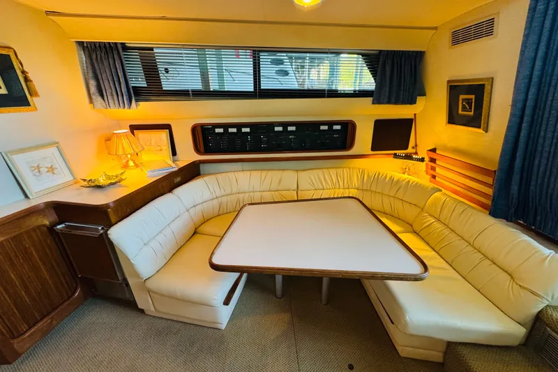 Slide: The Image of Cozy interior of 1989 Carver 38 Santego yacht with plush seating and elegant decor. - 50