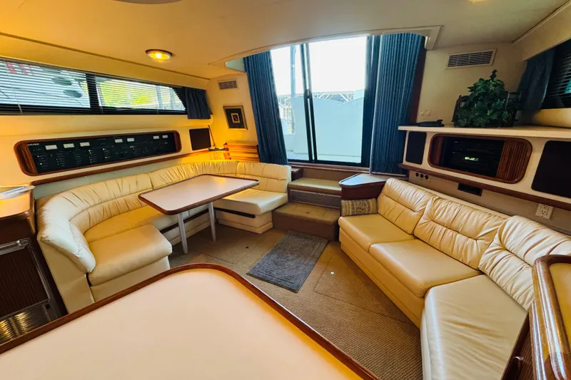 Slide: The Image of Luxurious interior of 1989 Carver 38 Santego yacht with plush seating and elegant decor. - 54