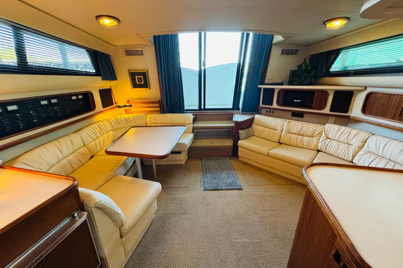 Slide: The Image of Luxurious interior of 1989 Carver 38 Santego yacht with plush seating and elegant decor. - 55