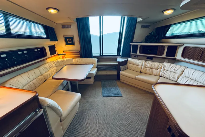 Slide: The Image of Luxurious interior of a 1989 Carver 38 Santego yacht with plush seating and elegant decor. - 56