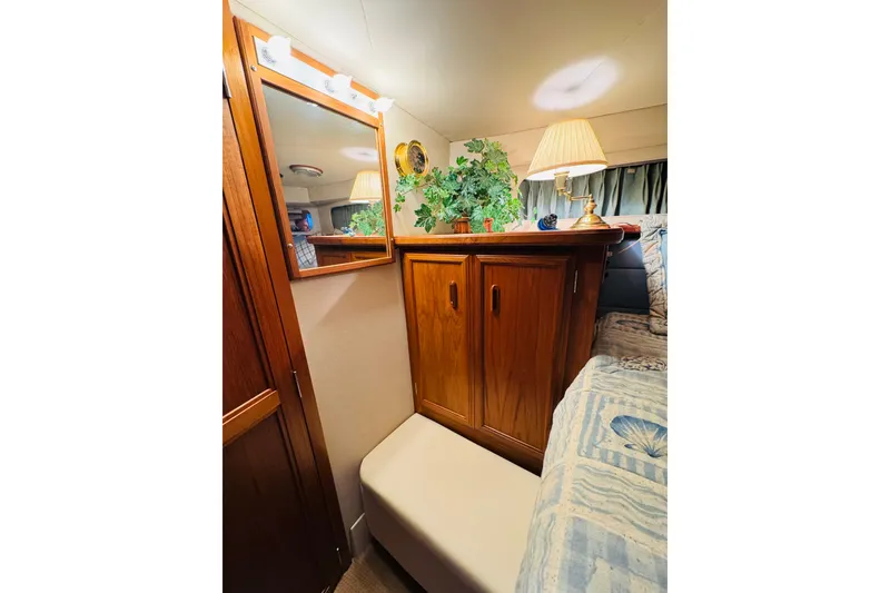 Slide: The Image of Interior of 1989 Carver 38 Santego yacht with wooden cabinetry and cozy decor. - 60