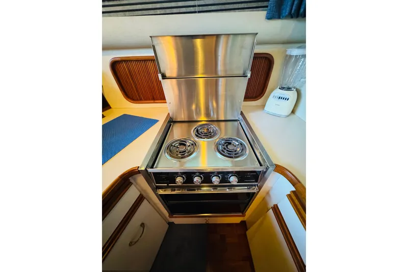 Slide: The Image of Stainless steel stove in 1989 Carver 38 Santego yacht kitchen. - 68