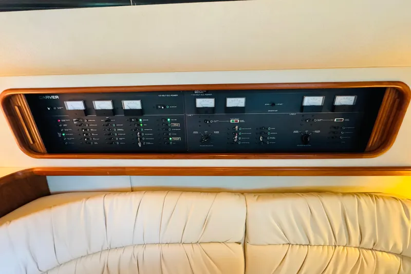 Slide: The Image of Control panel of a 1989 Carver 38 Santego yacht, featuring gauges and switches. - 71