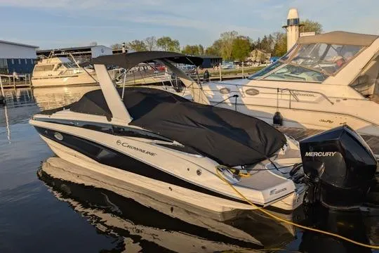The Image of 2023 Crownline Eclipse E285 XS boat docked with cover and Mercury outboard. - 0