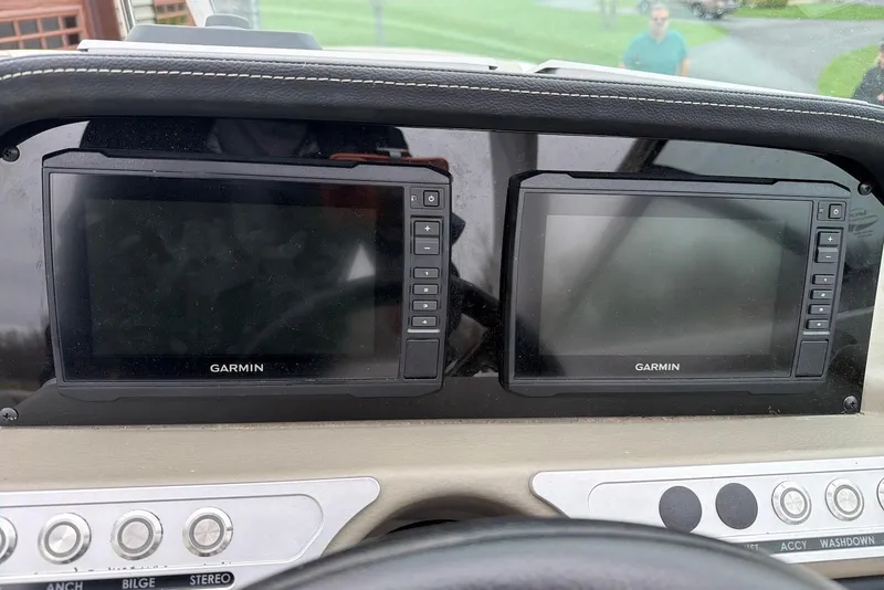 Slide: The Image of Dashboard of 2023 Crownline Eclipse E285 XS with dual Garmin displays. - 10