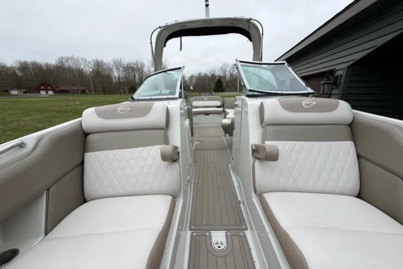 Slide: The Image of 2023 Crownline Eclipse E285 XS boat interior with luxurious seating and modern design. - 13