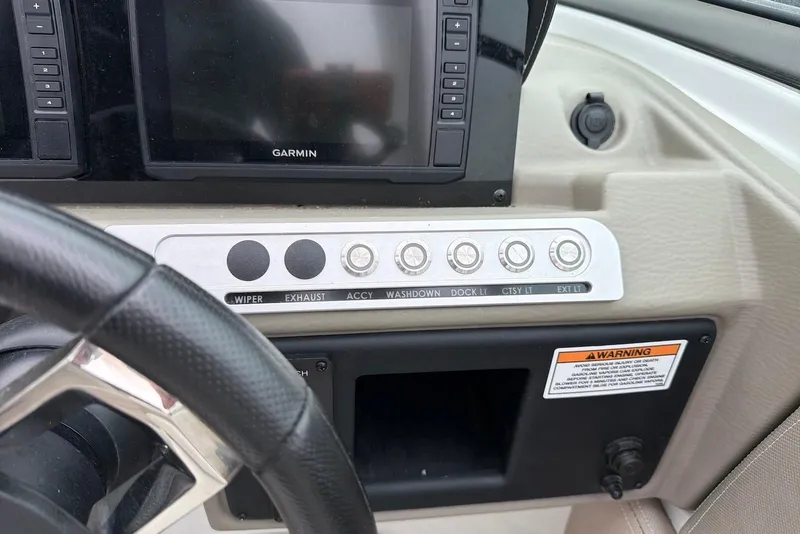 Slide: The Image of Control panel of 2023 Crownline Eclipse E285 XS boat with Garmin display. - 9