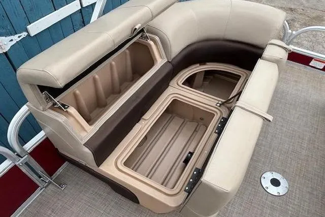 Slide: The Image of 2019 Sun Tracker SportFish 22 DLX boat seating with open storage compartments. - 15