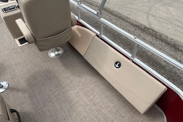 Slide: The Image of 2019 Sun Tracker SportFish 22 DLX interior with beige seating and carpeted flooring. - 25