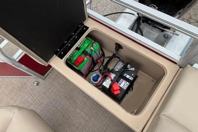 Slide: The Image of 2019 Sun Tracker SportFish 22 DLX boat battery compartment with wiring and connections. - 30