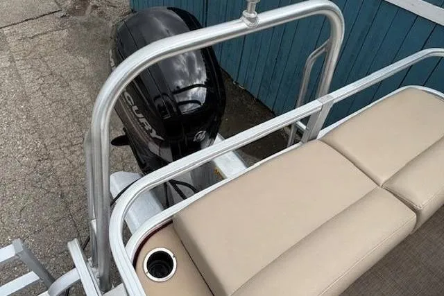 Slide: The Image of 2019 Sun Tracker SportFish 22 DLX pontoon boat with Mercury outboard motor and beige seating. - 31