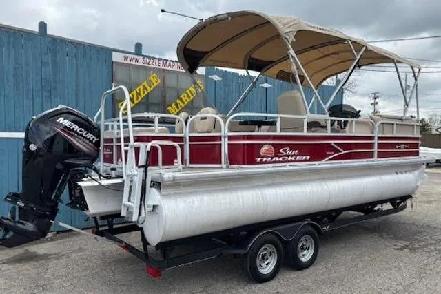 Slide: The Image of 2019 Sun Tracker SportFish 22 DLX pontoon boat with canopy and Mercury outboard motor. - 6