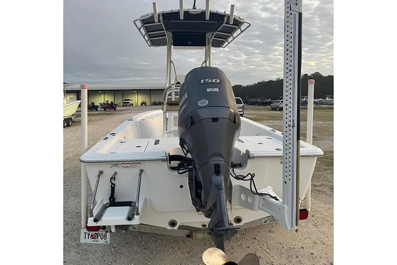 Slide: The Image of 2016 Sportsman Masters 207 Bay Boat with Yamaha outboard motor, parked outdoors. - 4