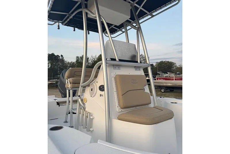 Slide: The Image of 2016 Sportsman Masters 207 Bay Boat interior with seating and console view. - 6