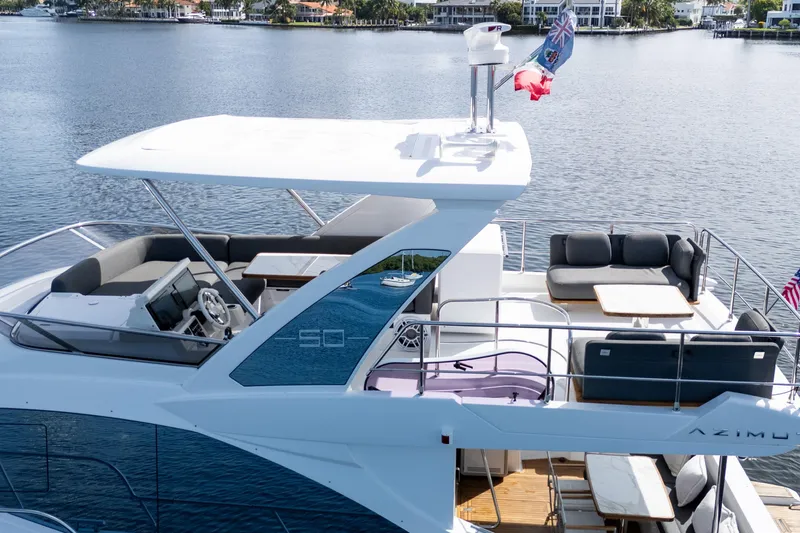 Slide: The Image of 2023 Azimut Fly 50 yacht with spacious deck and modern design on a serene waterway. - 10