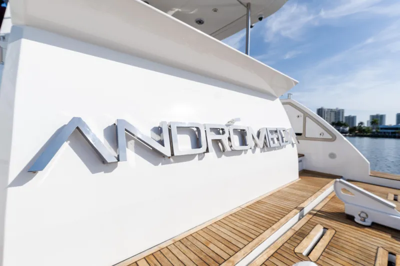 Slide: The Image of 2023 Azimut Fly 50 yacht with "Andromeda" nameplate, docked by the water. - 22