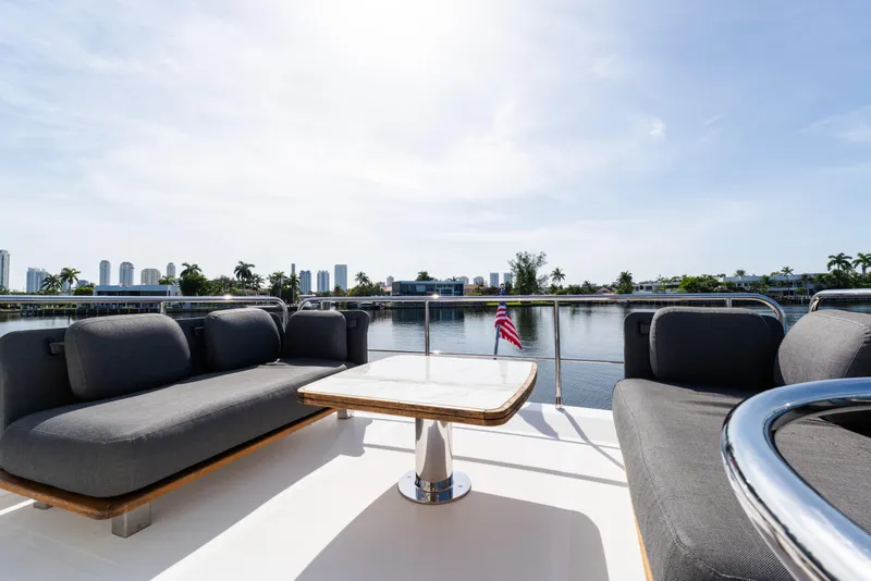 Slide: The Image of Luxurious 2023 Azimut Fly 50 yacht deck with elegant seating and scenic waterfront view. - 39