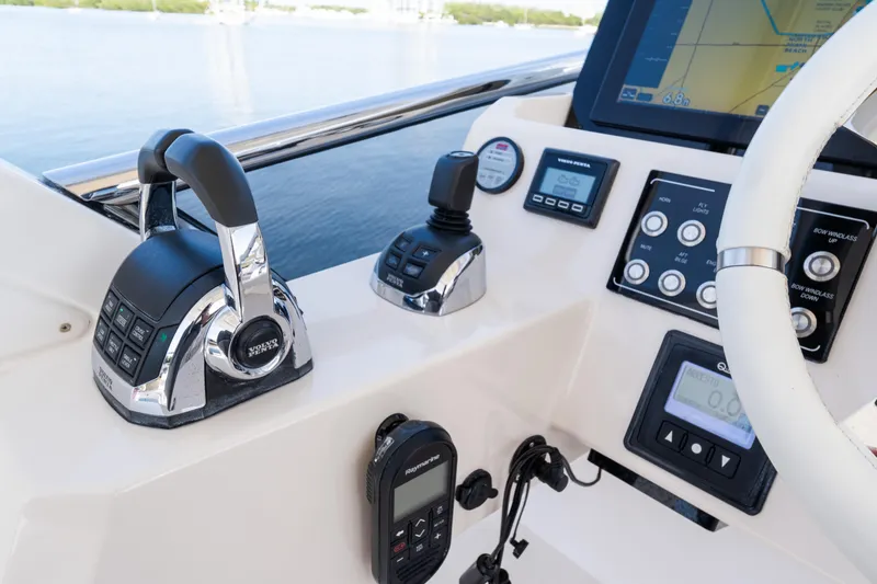Slide: The Image of Control panel of 2023 Azimut Fly 50 yacht with navigation and throttle systems. - 46