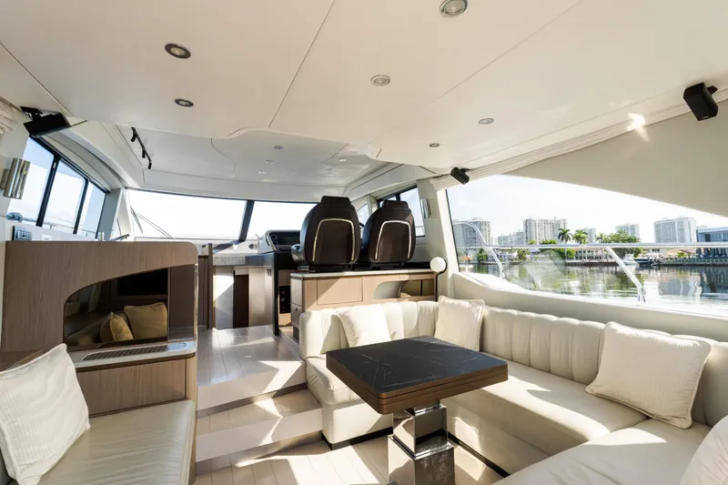 Slide: The Image of Luxurious interior of 2023 Azimut Fly 50 yacht with modern seating and panoramic windows. - 56