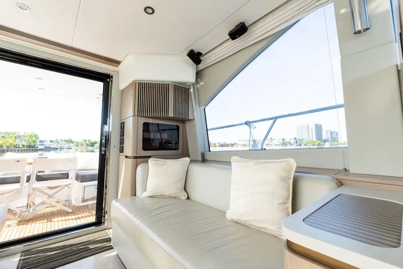 Slide: The Image of Luxurious interior of 2023 Azimut Fly 50 yacht with modern seating and large windows. - 64