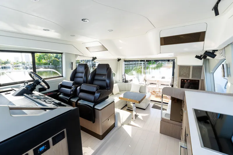 Slide: The Image of Luxurious interior of 2023 Azimut Fly 50 yacht with modern seating and panoramic windows. - 70