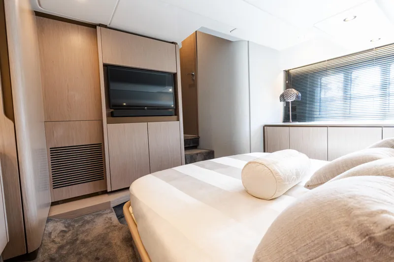 Slide: The Image of Luxurious bedroom interior of 2023 Azimut Fly 50 yacht with modern design and elegant furnishings. - 89