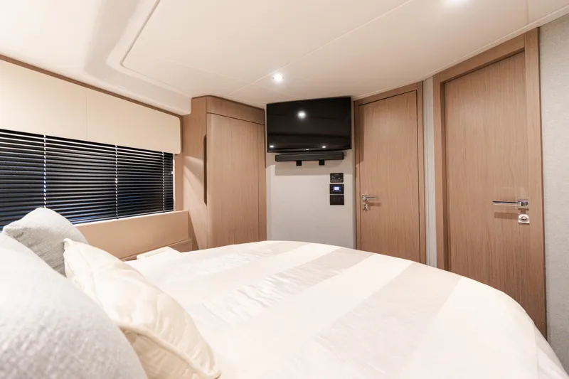 Slide: The Image of Luxurious bedroom interior of 2023 Azimut Fly 50 yacht with modern design and TV. - 99