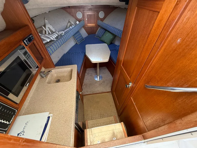 Slide: The Image of Interior of 2004 Albemarle 268 Express Fisherman with kitchenette and seating area. - 35