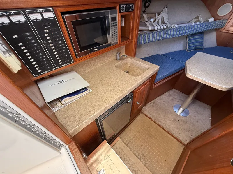 Slide: The Image of Interior of 2004 Albemarle 268 Express Fisherman with kitchenette and seating area. - 36